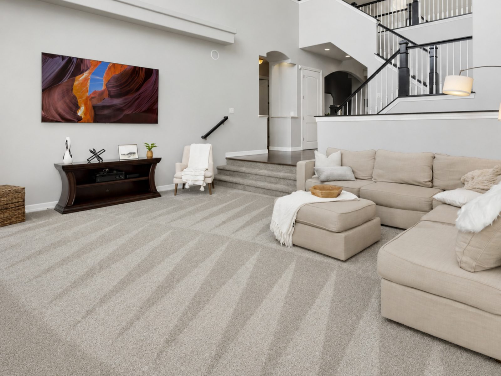 The same living room carpet showing fresh steam-extraction wand lines